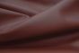Close up picture of burgundy smooth grain leather for upholstery