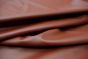 Close up picture of chestnut brown smooth grain leather for upholstery