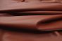 Close up picture of chestnut brown smooth grain leather for upholstery