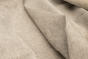 Close up of white with darker accents hair on upholstery leather