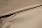 Closeup of pearlized taupe top grain upholstery leather