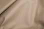 Closeup of pearlized taupe top grain upholstery leather
