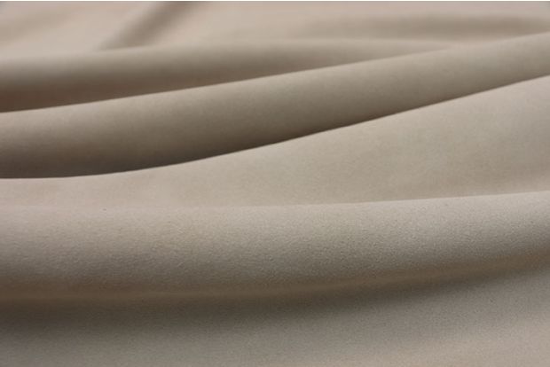 Closeup picture of soft cream suede showing texture of leather