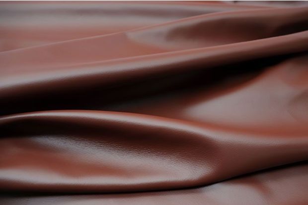 Picture of Cinnabr nappa leather for upholstery showing smooth grain.