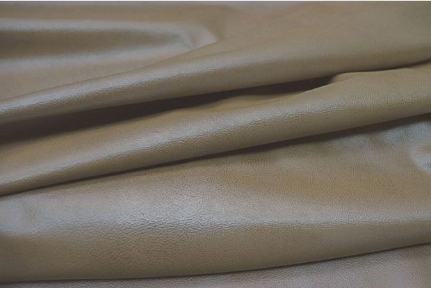 Close up picture of champagne natural grain cowhide leather