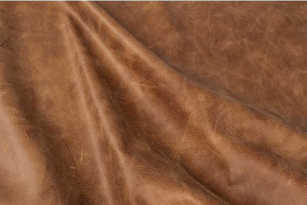 Close up of rich brown multitone distress upholstery leather