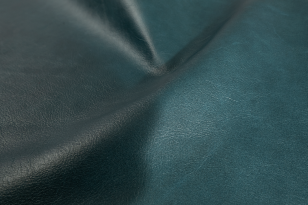 Close up picture of deep teal full grain upholstery leather