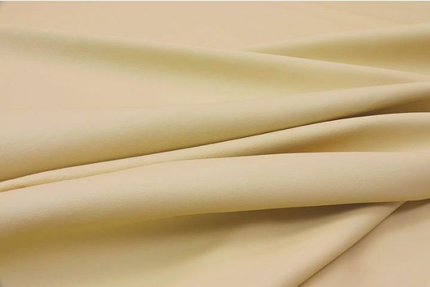 Close-up picture of Italian Beach, warm tan colored top grain leather for upholstery.