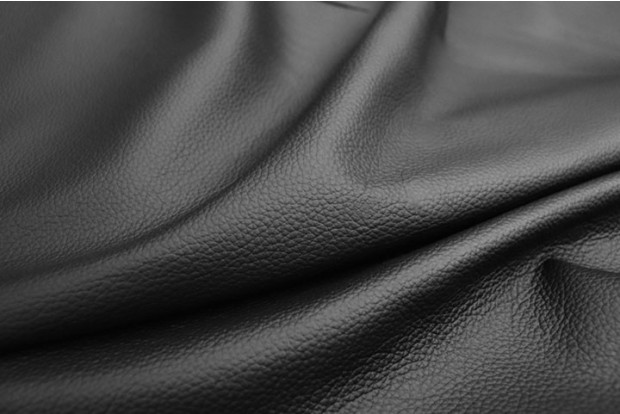 Close up picture of rich black leather with a pebble grain for upholstery