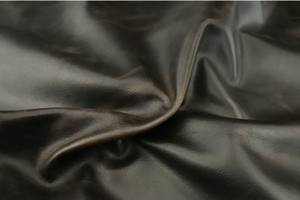 Close up of espresso brown full grain distressed upholstery leather