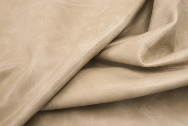 Close up of warm tan semi aniline upholstery leather