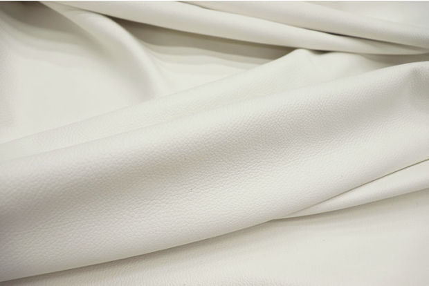 Close-up picture of Snow White rich white  leather for upholstery with pebble grain texture.