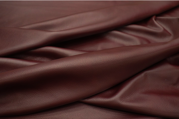 Picture of draping Burgundy Wine, rich wine colored cowhide leather for upholstery and furniture