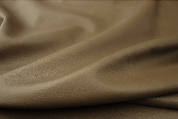 Close up picture of warm mushroom full grain upholstery leather