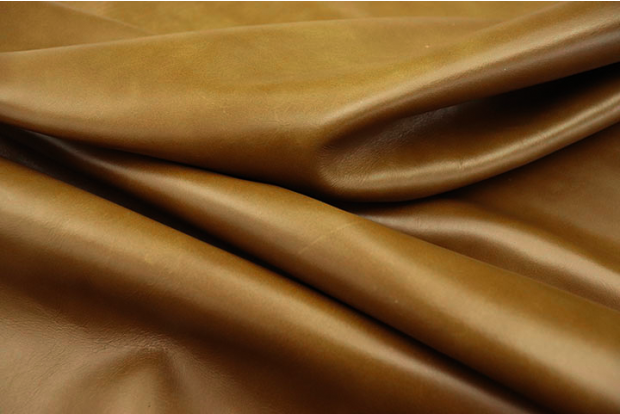 Close up picture of golden amaretto pull up upholstery leather