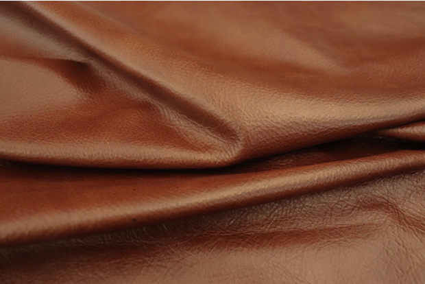 Close up of rich multi tone brandy full grain upholstery leather