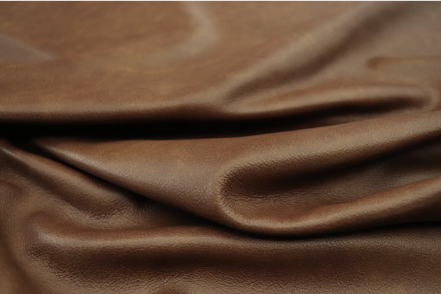 Close up picture of multitone medium brown semi aniline upholstery leather