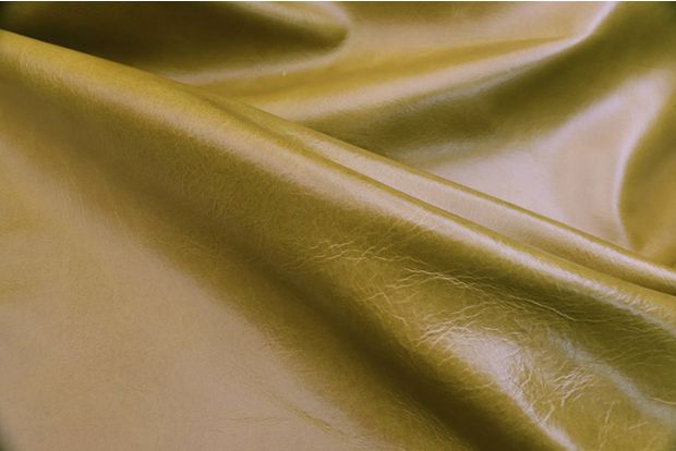 Close up picture of warm Pistachio semi aniline upholstery leather 