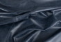 Close up of navy blue aniline dyed upholstery leather