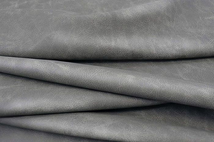 Picture showing the characteristics of a light grey distressed leather hide