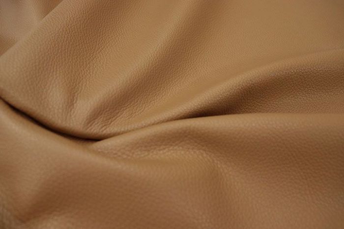 Close up picture of golden tan pebble grain upholstery leather