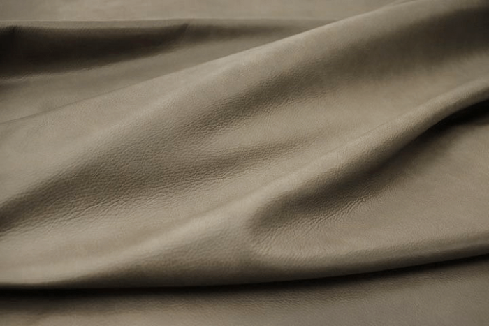 Closeup picture of Mellow Mist soft, medium grey colored upholstery leather for furniture