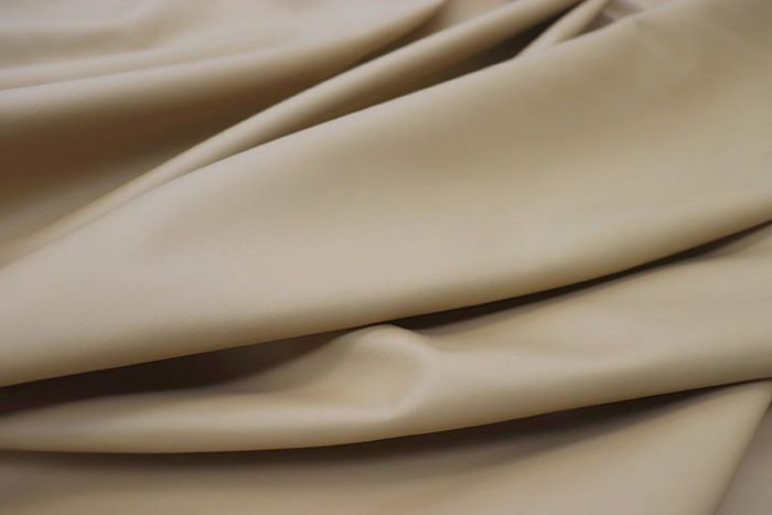 Close up picture of khaki smooth grain leather for upholstery