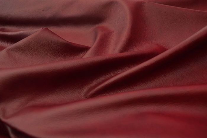 Picture showing the characteristics of deep red multi-tone leather for upholstery