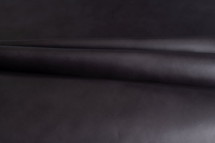 Close up of muted slate grey full grain upholstery leather