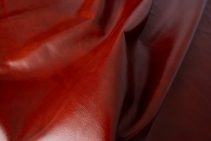Close up of multitone red semi aniline upholstery leather