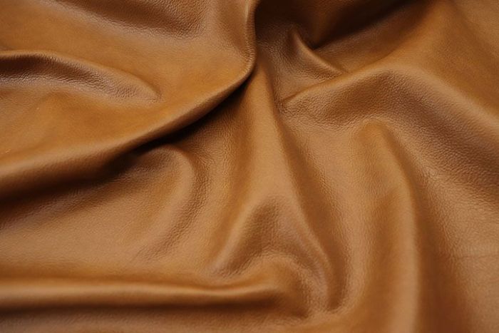 Closeup picture of Bourbon Street soft, bourbon colored upholstery leather for furniture