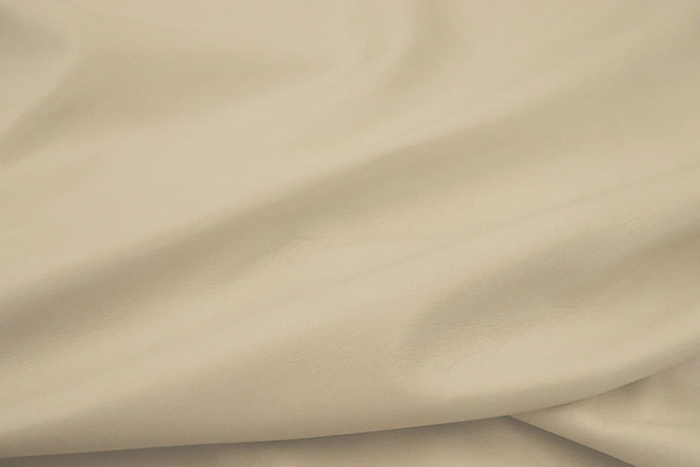 Close up picture of pearl colored pigmented upholstery leather 
