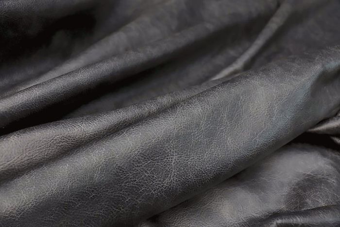 Picture showing the characteristics of a black distressed leather hide