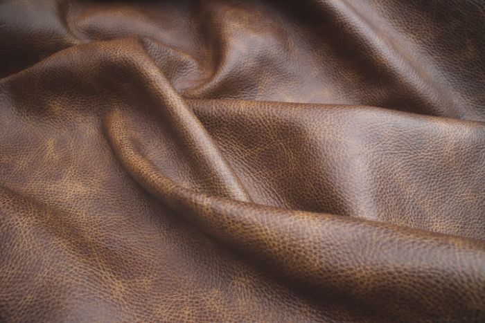 Picture showing the characteristics of a saddle brown distressed leather hide