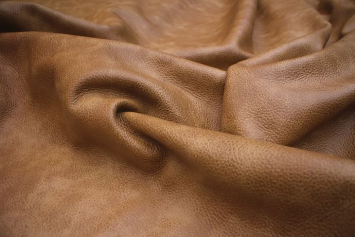 Close up picture of golden brown distressed leather for upholstery