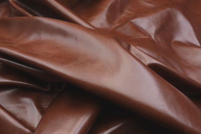 Close up picture of harness brown aniline leather for upholstery