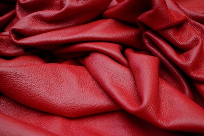 Close up picture of red pigmented leather for upholstery 
