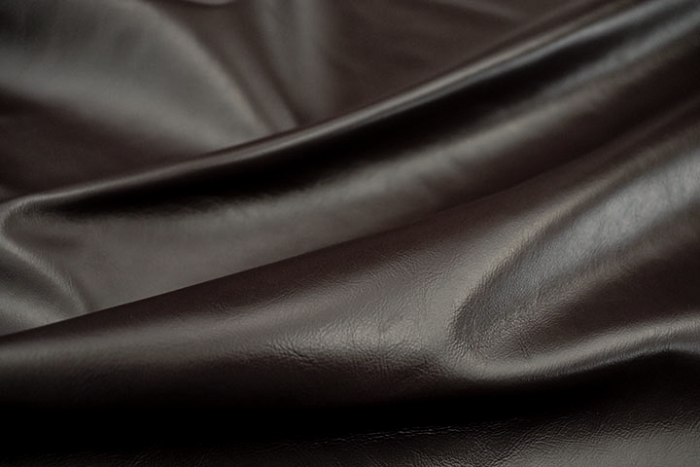 Close up of dark brown full grain upholstery leather