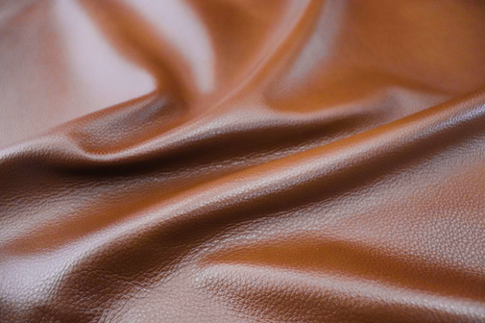 Close up picture of multitone cognac pigmented upholstery leather