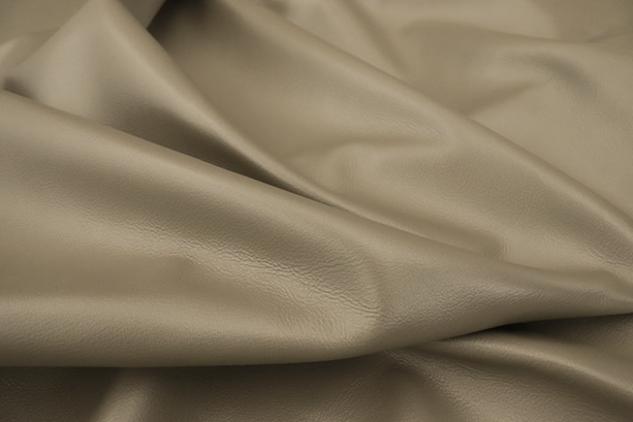 Close up of pearlized taupe top grain upholstery leather