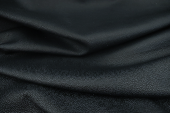Close up of deep navy full grain upholstery leather