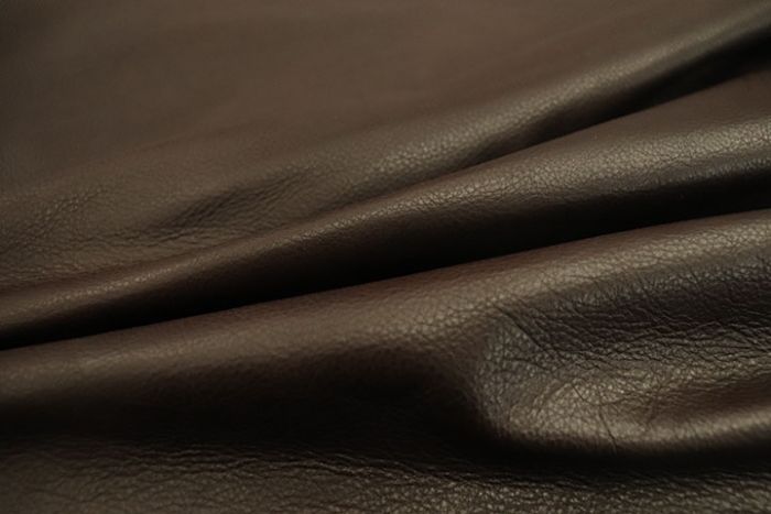 Close up of rich dark brown pigmented upholstery leather