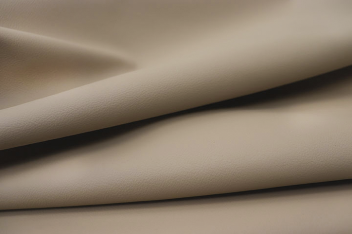 Close-up picture of Morning Khaki, leather fabric for chairs, sofas and furniture upholstery.