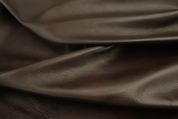 Close up picture of warm chocolate brown top grain upholstery leather