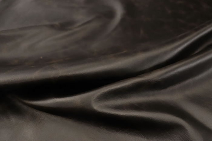 Close up of espresso brown full grain distressed upholstery leather