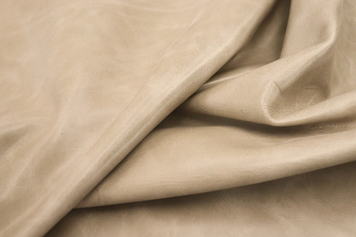 Close up of warm tan semi aniline upholstery leather