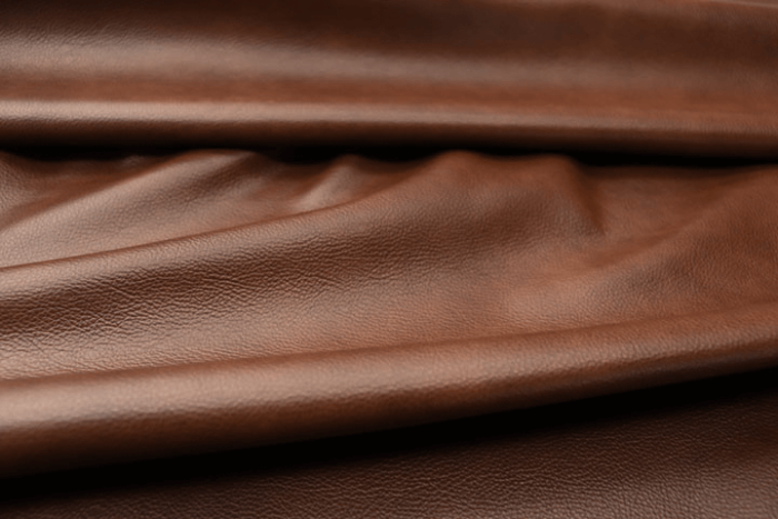 Closeup picture of Whiskey Beat soft, rich warm brown colored upholstery leather for furniture