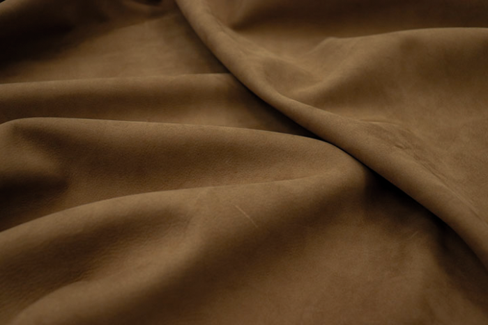 Closeup picture of soft olive nubuck showing the texture of leather