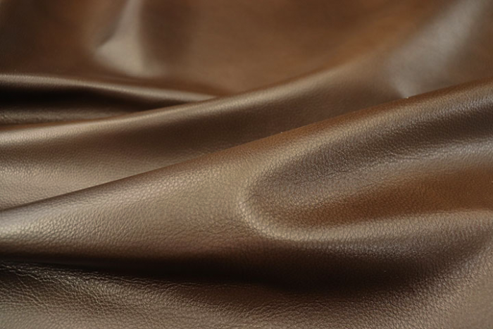 Close up picture of tobacco brown full grain leather hide for upholstery