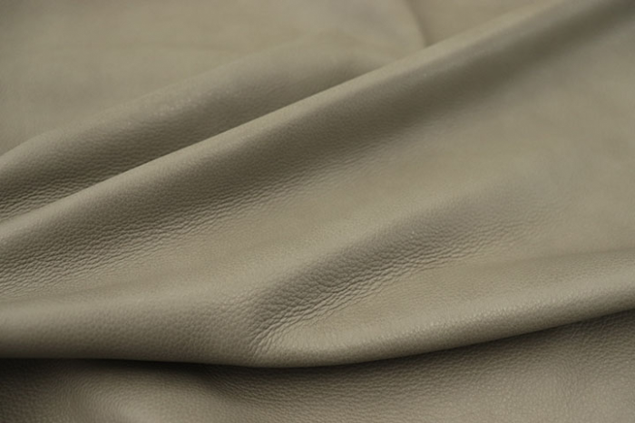 Close up picture of medium grey full grain leather for upholstery